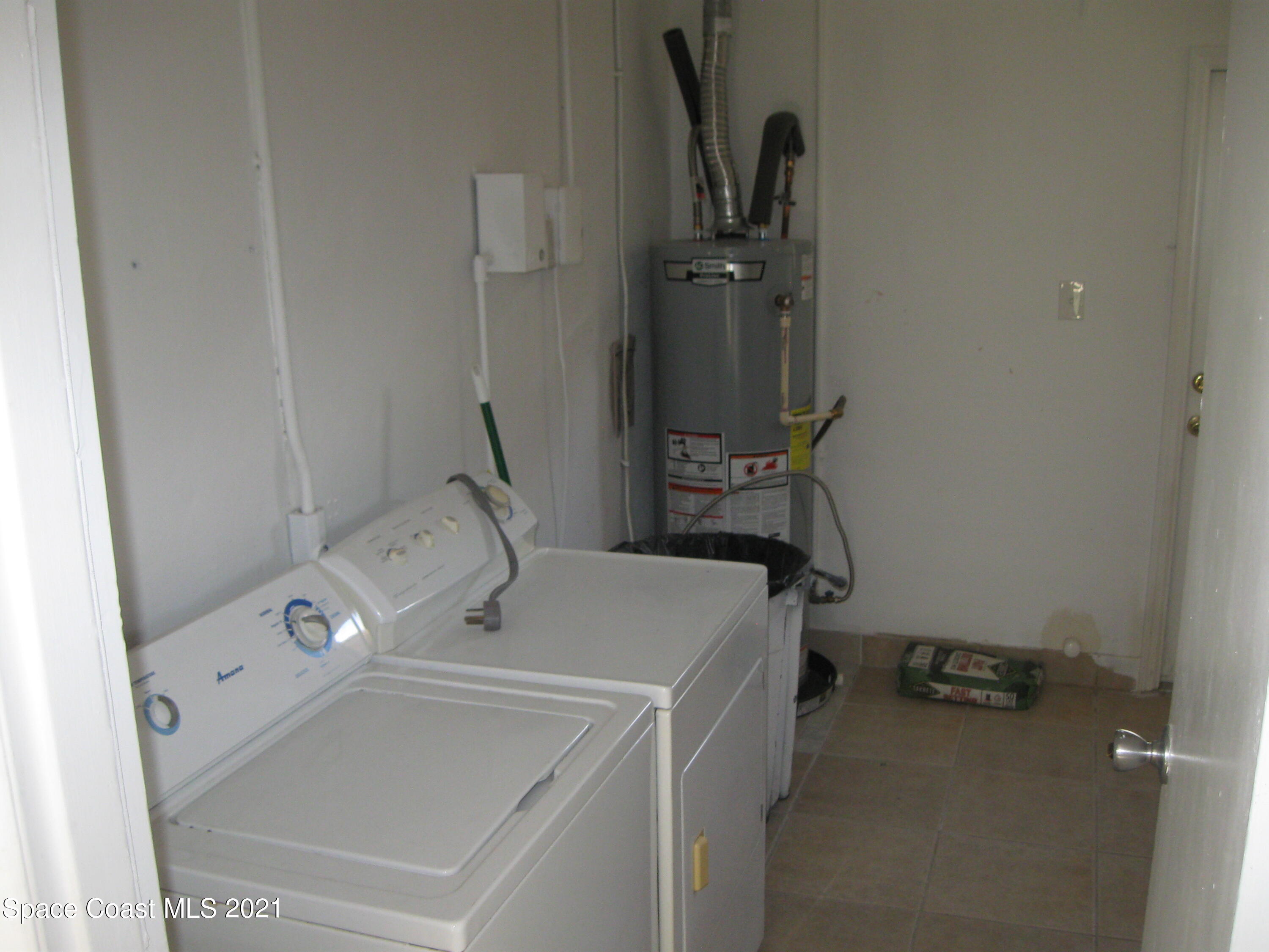 770 Sandgate Street Merritt Island, FL 32953 - Photo 18 of 22 a utility room with dryer and washer