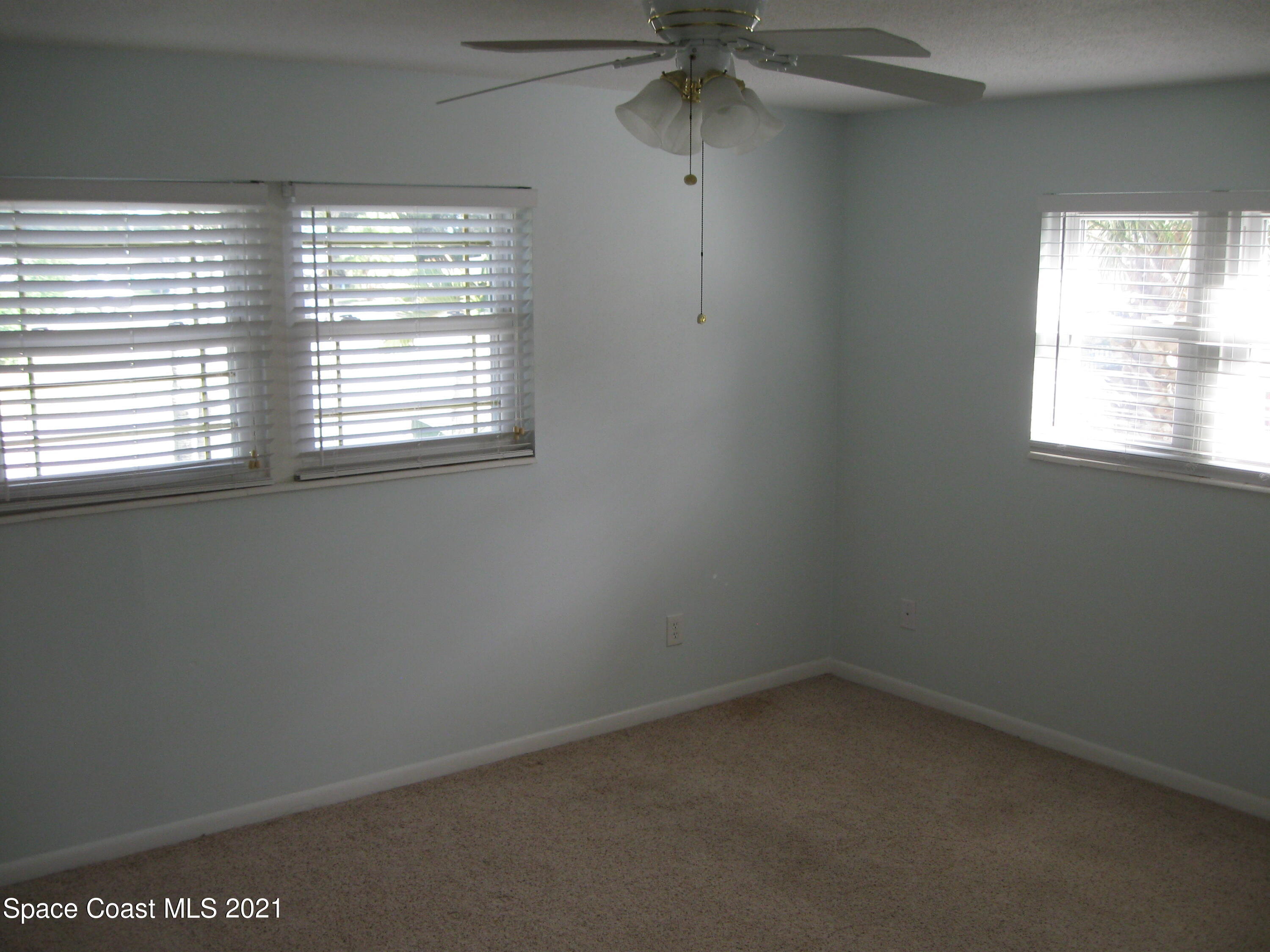 770 Sandgate Street Merritt Island, FL 32953 - Photo 8 of 22 an empty room with a window