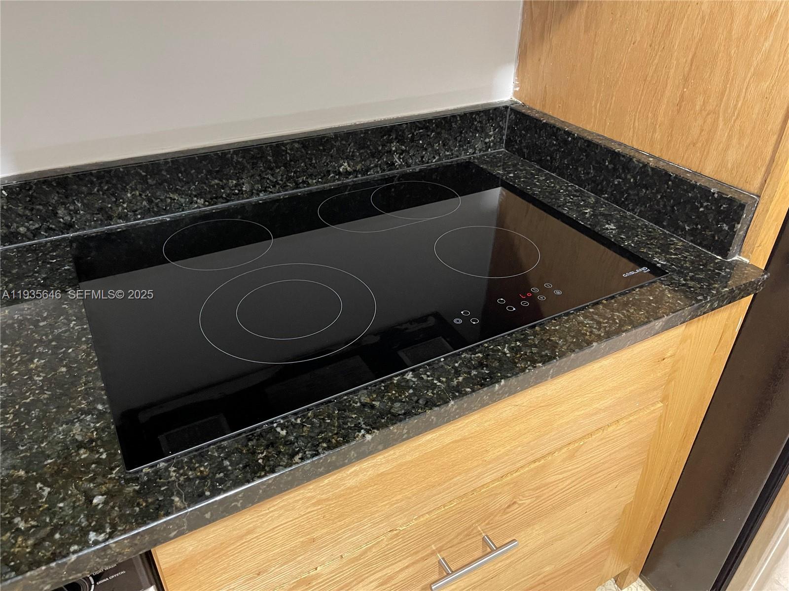 1750 Northwest 107th Avenue, Unit R508 Sweetwater, FL 33172 - Photo 5 of 15 a close view of sink and washing machine