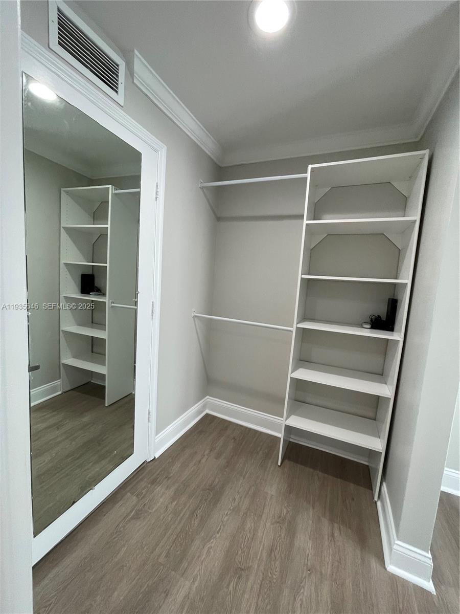 1750 Northwest 107th Avenue, Unit R508 Sweetwater, FL 33172 - Photo 10 of 15 a view of walk in closet with empty racks