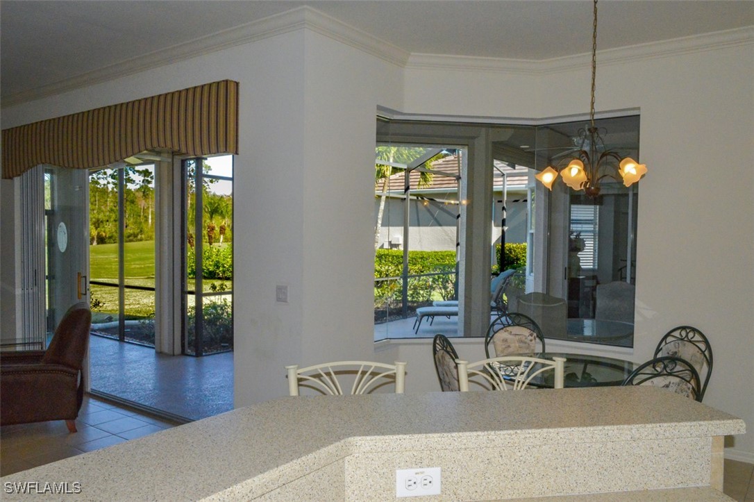 11142 Wine Palm Road Fort Myers, FL 33966 - Photo 15 of 42 a kitchen with a sink and a large window
