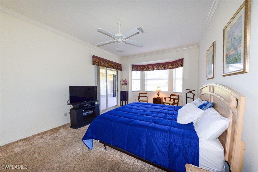 11142 Wine Palm Road Fort Myers, FL 33966 - Photo 20 of 42 a bed room with a bed television and a window