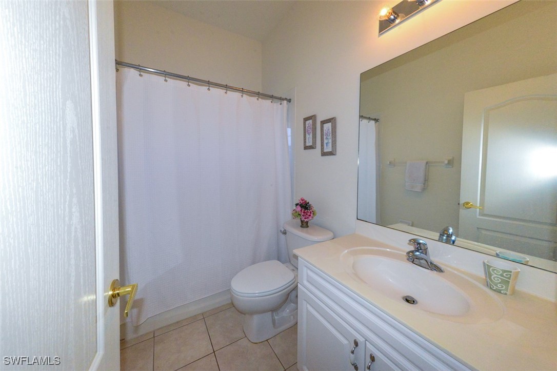 11142 Wine Palm Road Fort Myers, FL 33966 - Photo 29 of 42 a bathroom with a sink toilet and shower