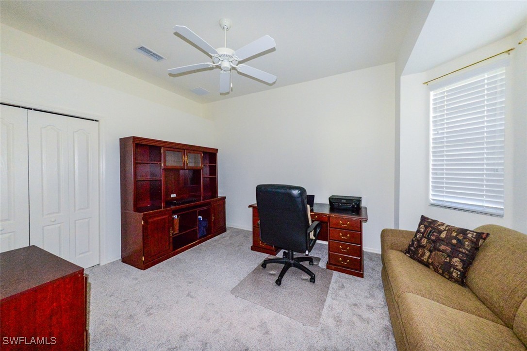 11142 Wine Palm Road Fort Myers, FL 33966 - Photo 30 of 42 a living room with furniture and a window