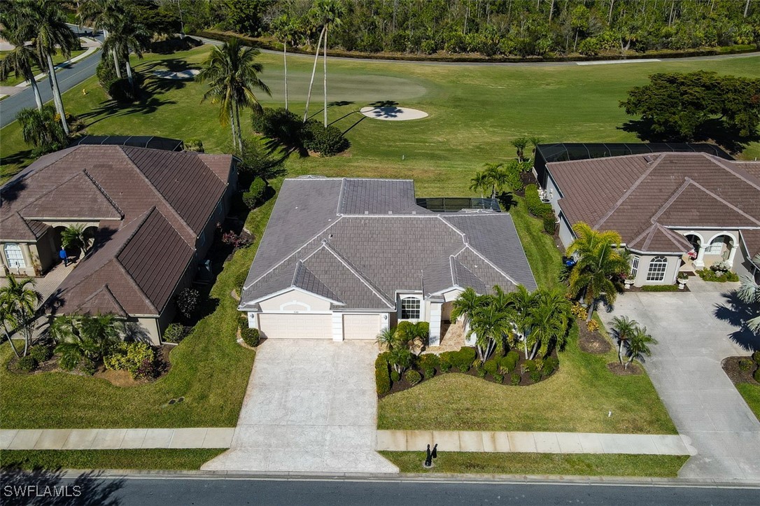11142 Wine Palm Road Fort Myers, FL 33966 - Photo 3 of 42 an aerial view of a house with garden space and lake view