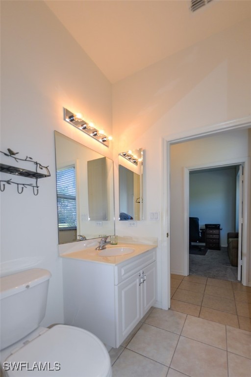 11142 Wine Palm Road Fort Myers, FL 33966 - Photo 34 of 42 a bathroom with a sink a toilet and mirror