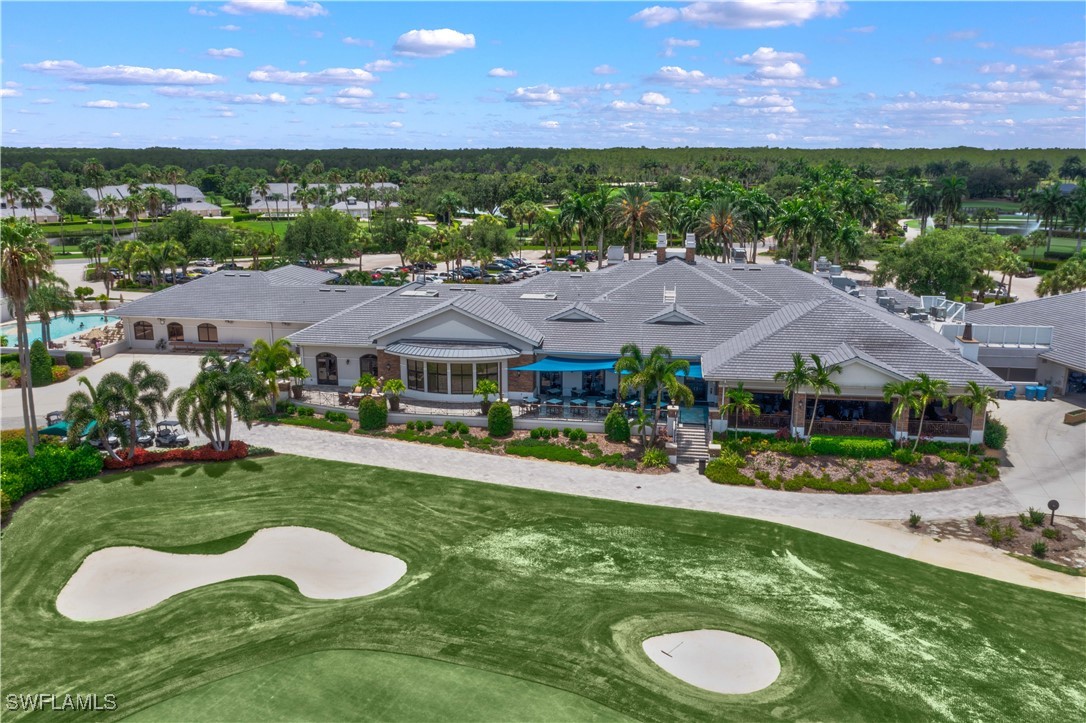11142 Wine Palm Road Fort Myers, FL 33966 - Photo 36 of 42 view of an house with swimming pool and yard with green space