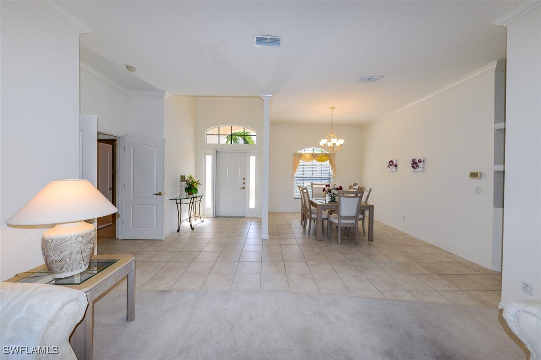 11142 Wine Palm Road Fort Myers, FL 33966 - Photo 9 of 42 a view of a livingroom with furniture and a lamp