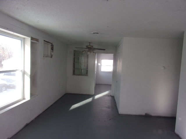 104 Algonquin Road Marquette Heights, IL 61554 - Photo 11 of 12 an empty room with wooden floor and windows