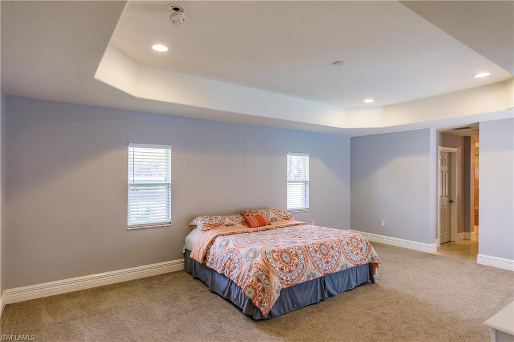 3881 Packinghouse Road Alva, FL 33920 - Photo 14 of 35 a bedroom with a bed and window