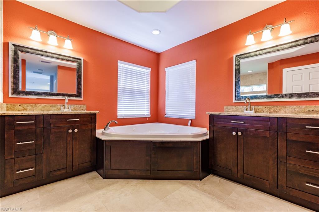 3881 Packinghouse Road Alva, FL 33920 - Photo 16 of 35 a bathroom with a granite countertop sink and a mirror