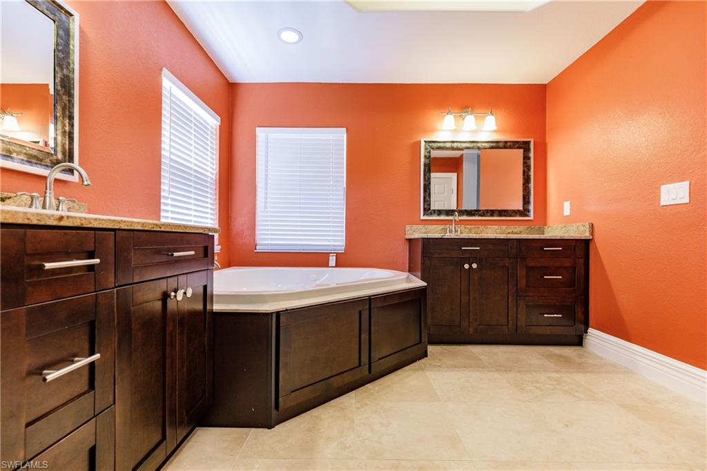 3881 Packinghouse Road Alva, FL 33920 - Photo 18 of 35 a kitchen with a sink and cabinets