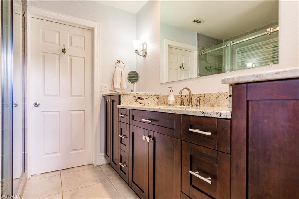 3881 Packinghouse Road Alva, FL 33920 - Photo 20 of 35 a bathroom with a sink vanity and a mirror