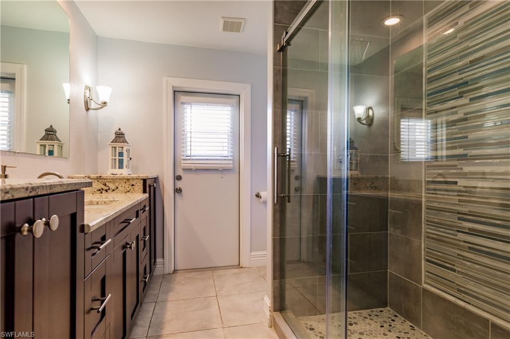 3881 Packinghouse Road Alva, FL 33920 - Photo 21 of 35 a bathroom with a shower and a sink