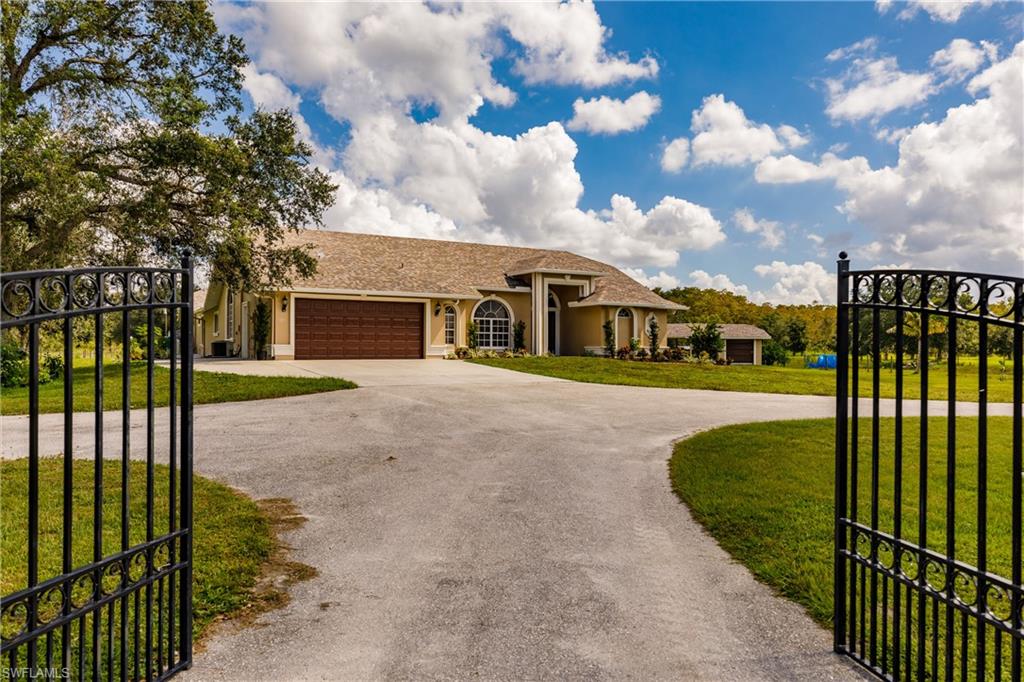 3881 Packinghouse Road Alva, FL 33920 - Photo 3 of 35 a view of a house with backyard