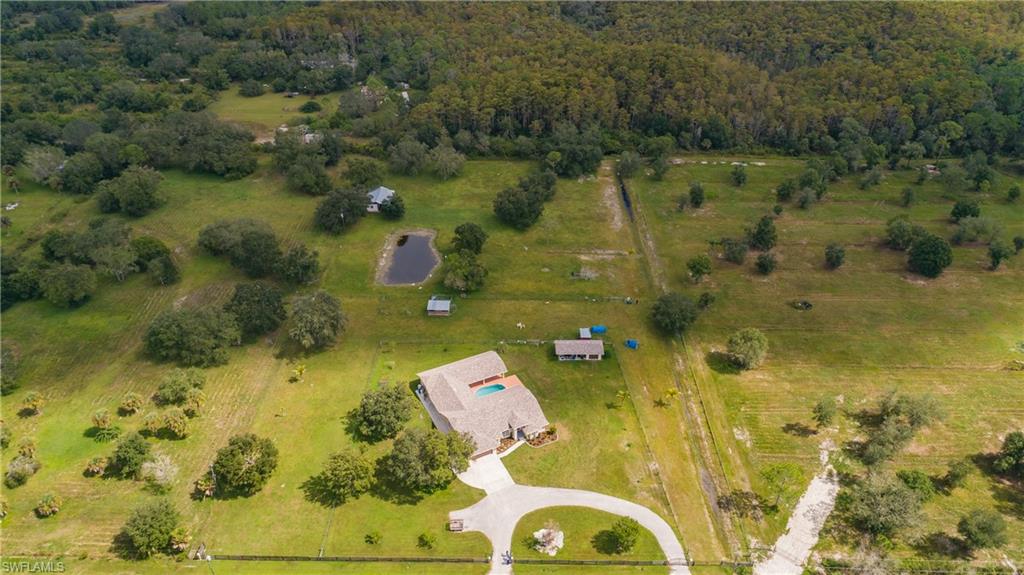 3881 Packinghouse Road Alva, FL 33920 - Photo 5 of 35 a aerial view of a residential houses with yard