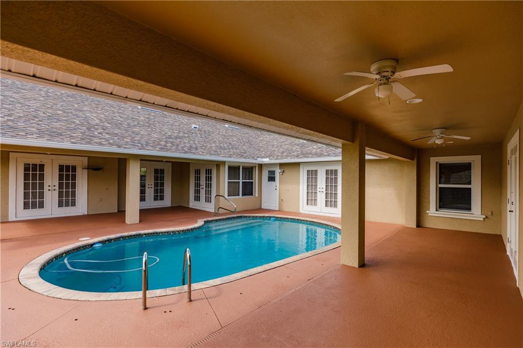 3881 Packinghouse Road Alva, FL 33920 - Photo 6 of 35 a view of a house with swimming pool and porch