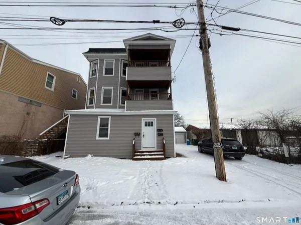 a view of a car park in front of house