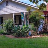 a view of a house with a yard and plants