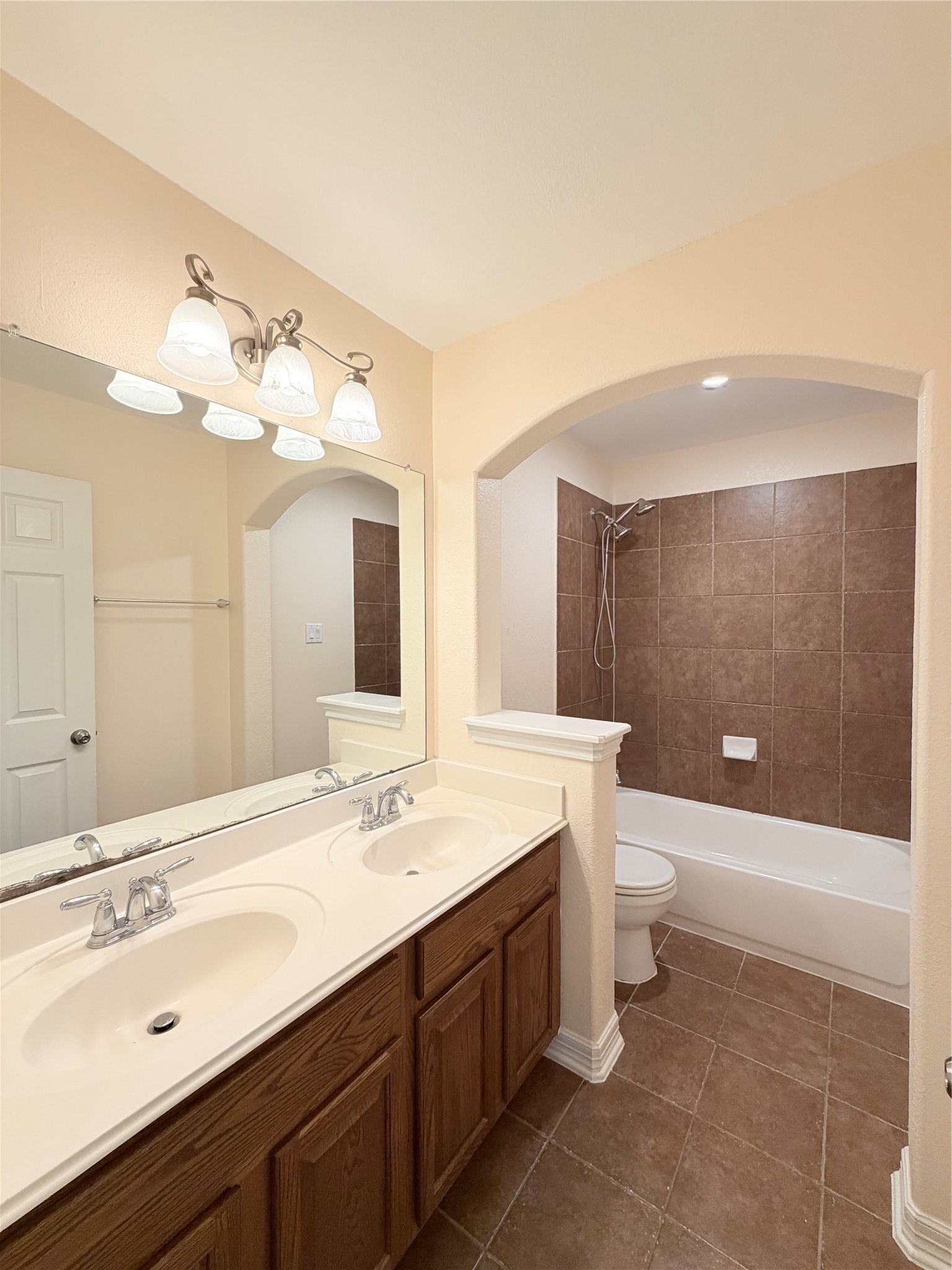 28015 Silverstream Court Fulshear, TX 77441 - Photo 27 of 33 a bathroom with a sink a toilet and shower