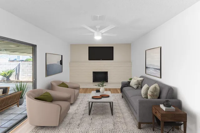 a dining room with furniture and wooden floor