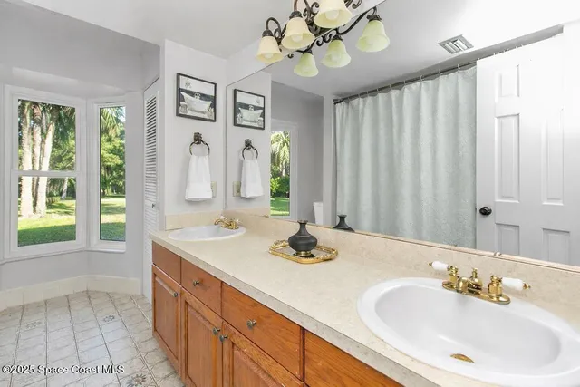 a bathroom with a toilet sink and shower