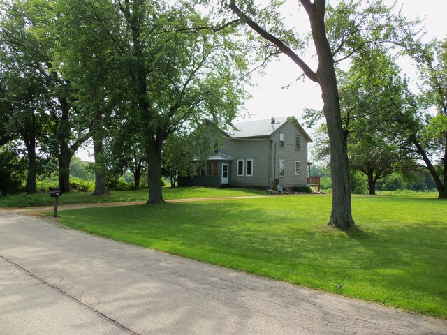 17419 Hebron Road Harvard, IL 60033 - Photo 11 of 22 a front view of house with yard and green space