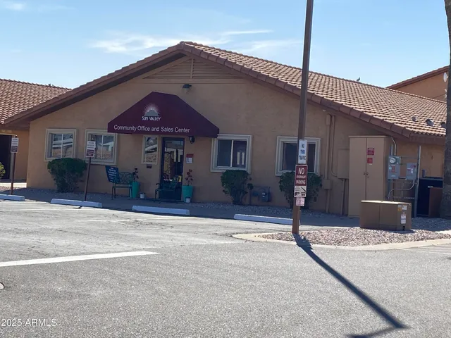 a en suite bathroom with a double vanity sink a mirror and a shower
