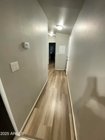 a view of a living room and kitchen
