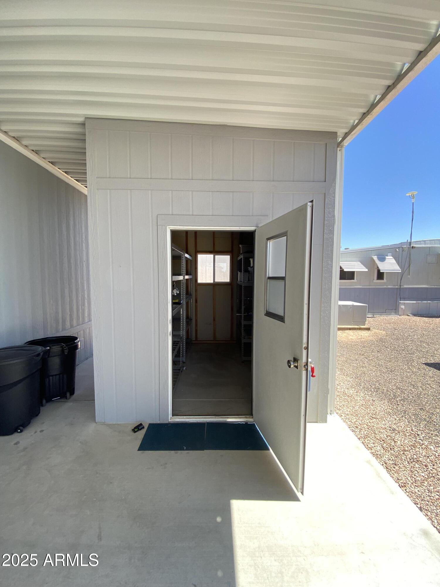 11101 East University Drive, Unit 171 Apache Junction, AZ 85120 - Photo 43 of 68 shed door open