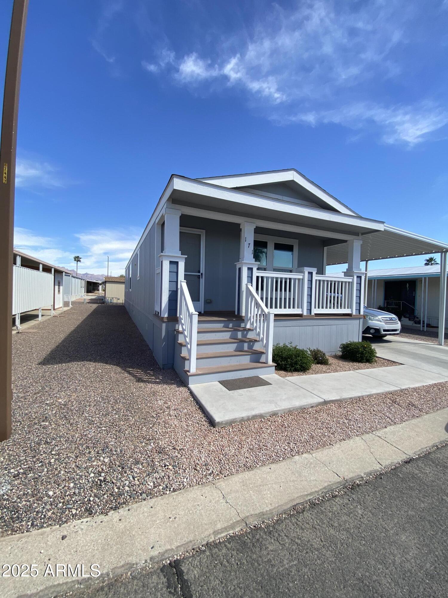 11101 East University Drive, Unit 171 Apache Junction, AZ 85120 - Photo 6 of 68 side of HOuse at angle yanuzzi