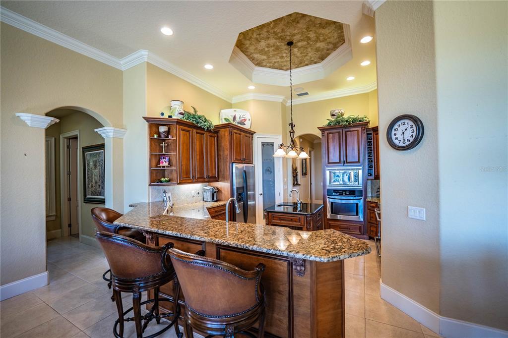 2918 Clubhouse Road Lakeland, FL 33812 - Photo 15 of 47 a kitchen with a table and chairs