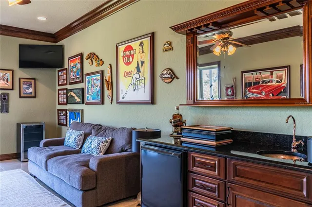 a kitchen with stainless steel appliances granite countertop a sink and a refrigerator