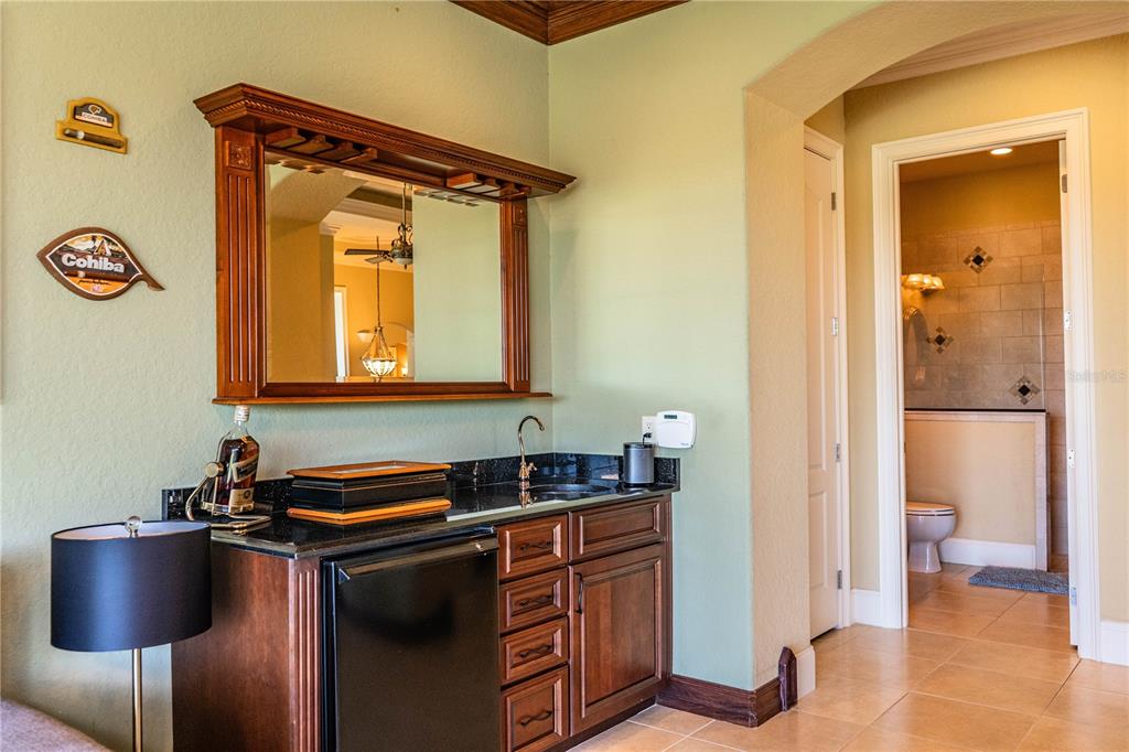 2918 Clubhouse Road Lakeland, FL 33812 - Photo 23 of 47 a kitchen with stainless steel appliances granite countertop a sink and a refrigerator