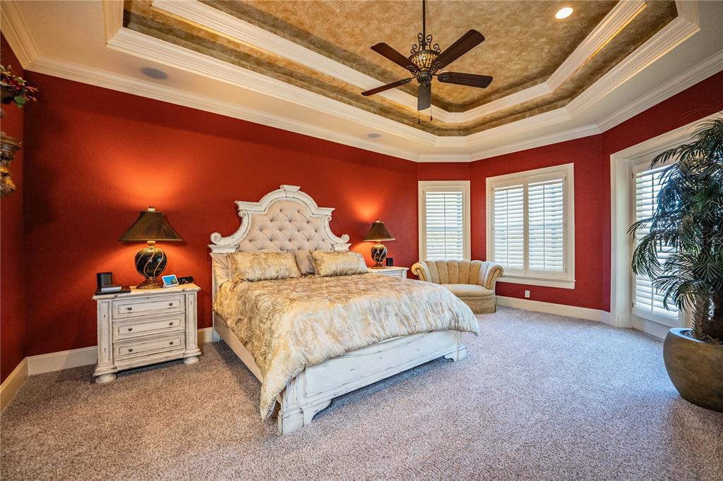2918 Clubhouse Road Lakeland, FL 33812 - Photo 25 of 47 a spacious bedroom with a bed and a potted plant