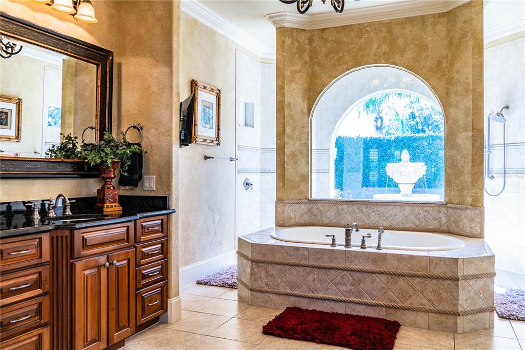 2918 Clubhouse Road Lakeland, FL 33812 - Photo 27 of 47 a living room with stainless steel appliances granite countertop a couch and a potted plant