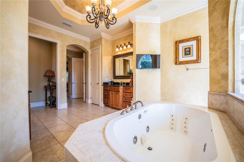2918 Clubhouse Road Lakeland, FL 33812 - Photo 30 of 47 a spacious bathroom with a tub sink and a window
