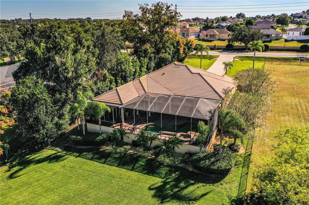 2918 Clubhouse Road Lakeland, FL 33812 - Photo 3 of 47 an aerial view of a house with swimming pool garden and patio