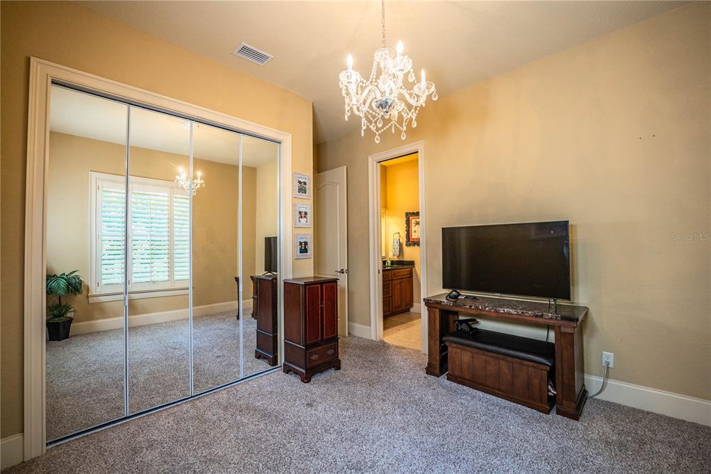 2918 Clubhouse Road Lakeland, FL 33812 - Photo 32 of 47 a living room with furniture and a flat screen tv