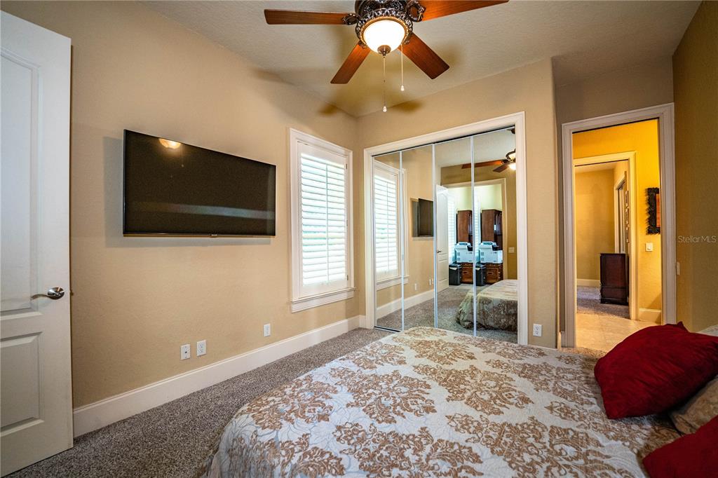 2918 Clubhouse Road Lakeland, FL 33812 - Photo 34 of 47 a bedroom with a bed and a flat screen tv