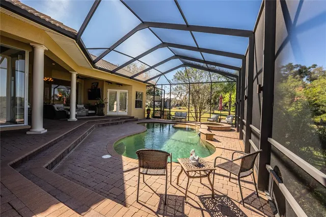 a building outdoor space with patio furniture and potted plants