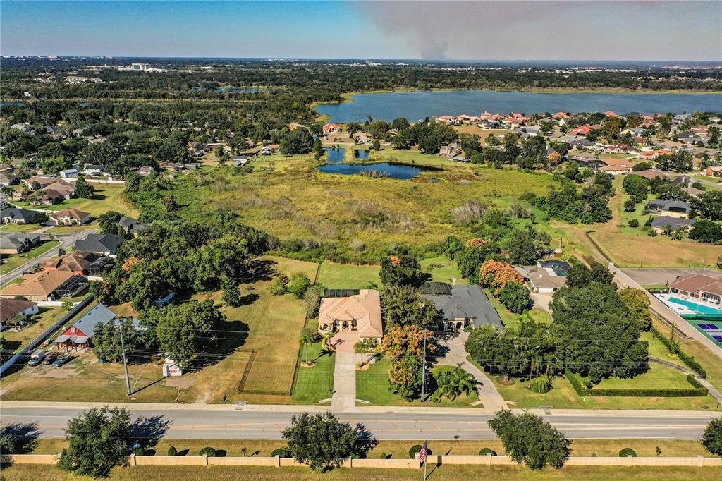 2918 Clubhouse Road Lakeland, FL 33812 - Photo 4 of 47 an aerial view of residential houses with outdoor space