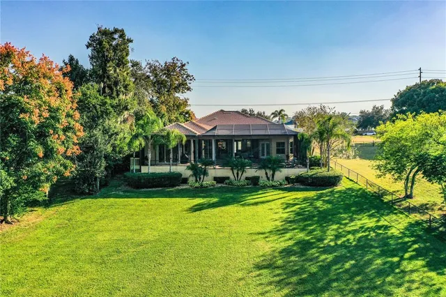 an aerial view of residential house with an outdoor space