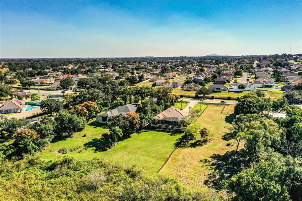 2918 Clubhouse Road Lakeland, FL 33812 - Photo 45 of 47 an aerial view of residential houses with outdoor space and trees