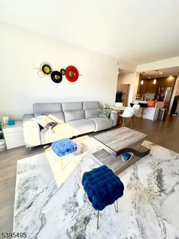 a living room with furniture and rug