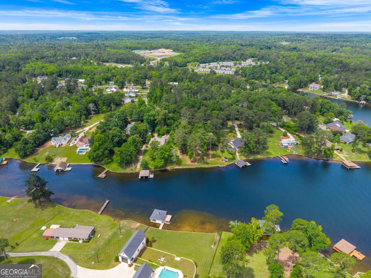 151 Bill Johnson Road Northeast Milledgeville, GA 31061 - Photo 16 of 27 a view of a lake with a house in the background