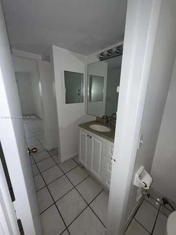 a bathroom with a sink and mirror