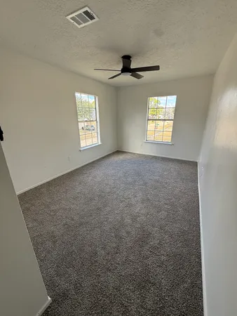 an empty room with windows