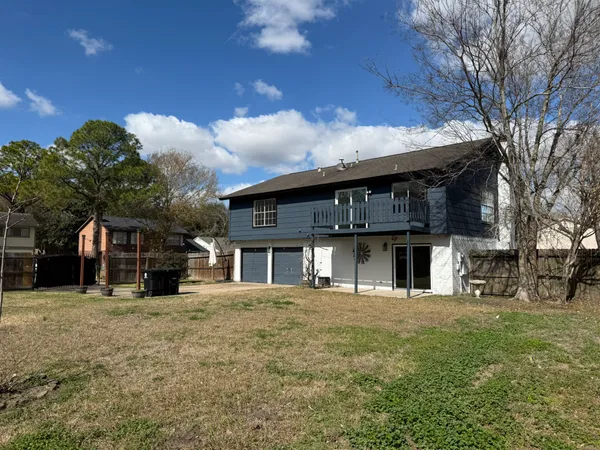 a front view of a house with a big yard