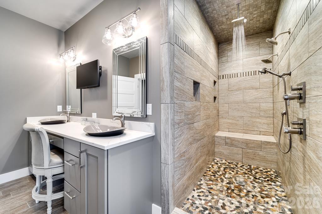 117 Amberleaf Way Cullowhee, NC 28723 - Photo 24 of 48 a bathroom with a sink and a mirror